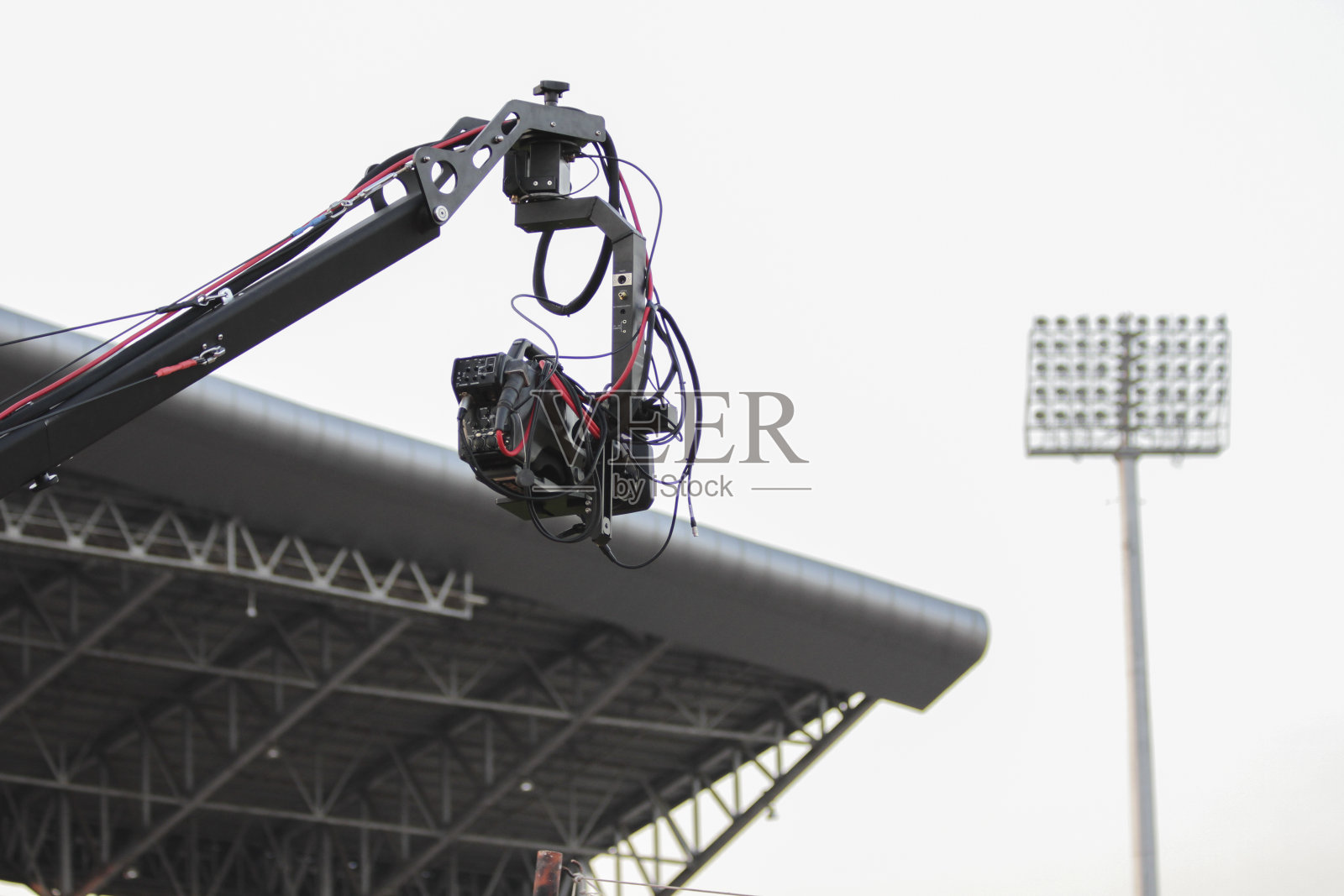 活动摄像机起重机现场直播足球马赫或音乐会。照片摄影图片