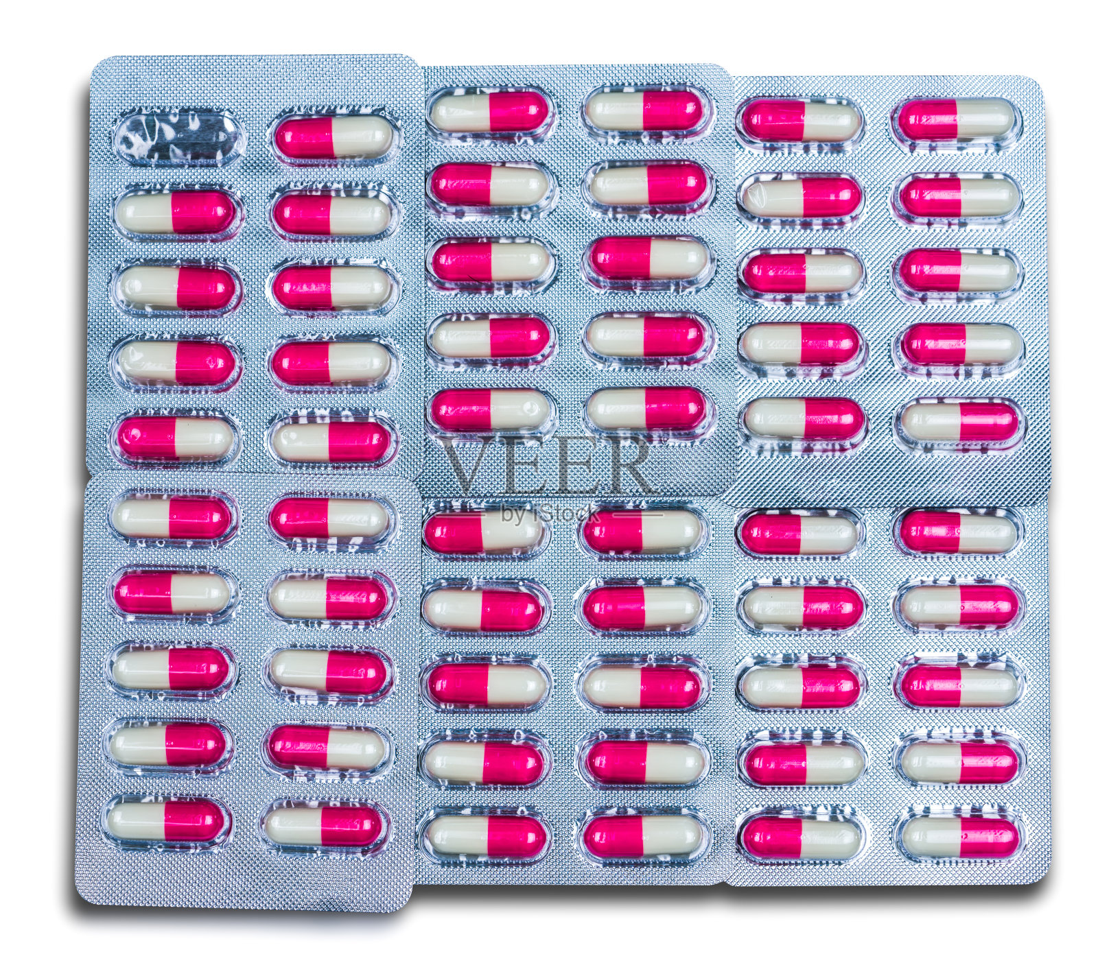 顶视图彩色抗生素胶囊丸在泡罩包装孤立在白色背景。具有合理的全球医疗保健和用药理念。粉白色抗菌胶囊。照片摄影图片