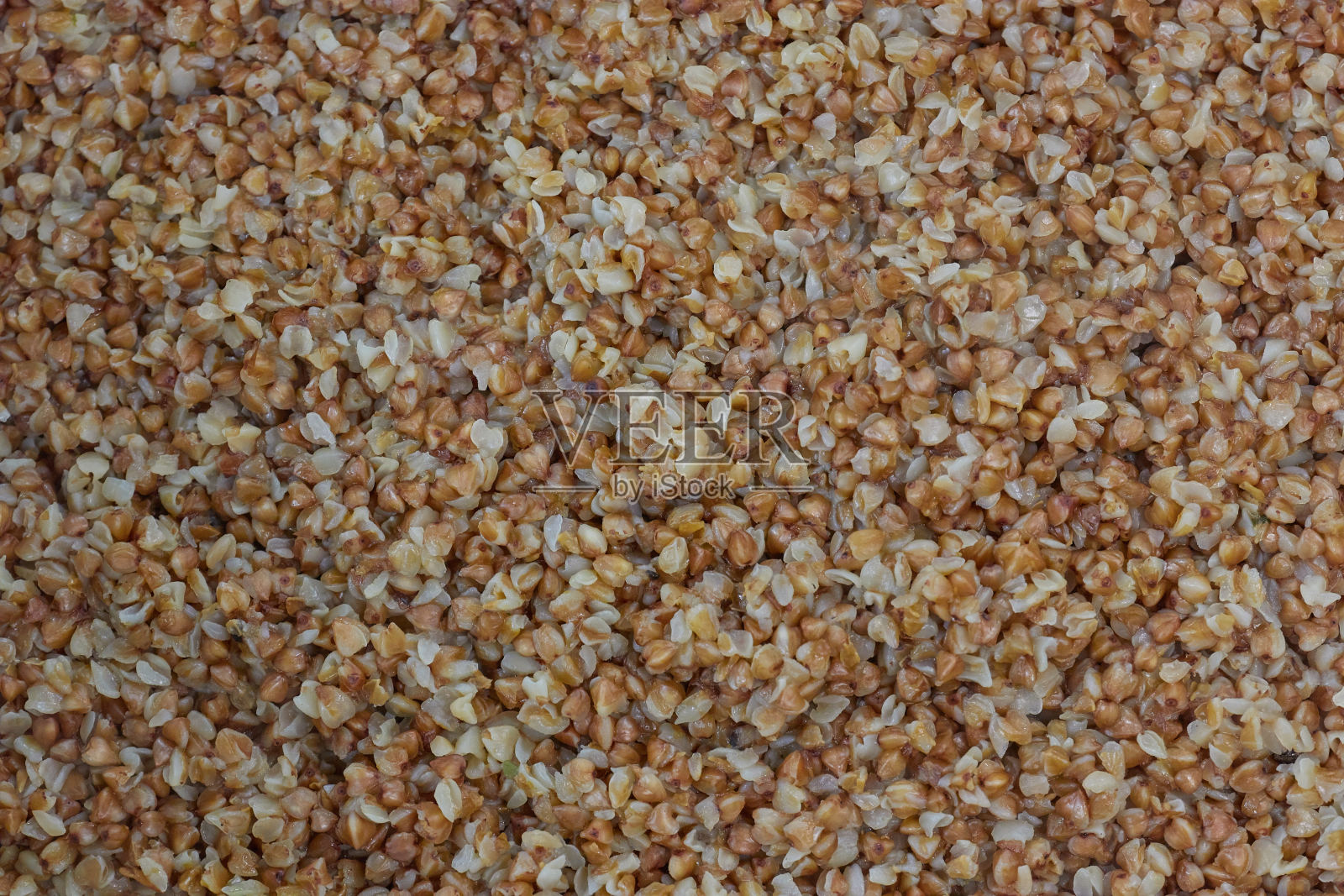 荞麦。荞麦的背景和质地。煮荞麦。荞麦煮粗燕麦粉。俄罗斯的铜板。照片摄影图片