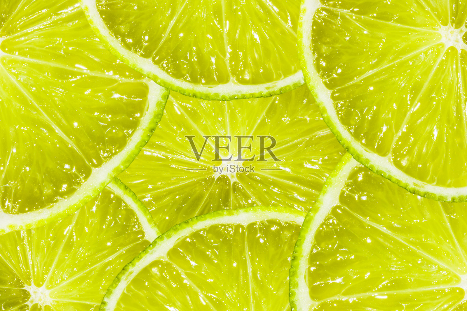 柠檬片。绿色食品的背景。夏天fruite。照片摄影图片