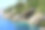 岩洞岩层，绿松石地中海海滩，田园诗般的杜布罗夫尼克堡垒城市景观和蓝色的海湾，绿松石亚得里亚海全景-达尔马提亚，克罗地亚素材图片