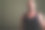 工作室拍摄的成熟的秃顶肌肉男子穿着无袖上衣对着彩色背景素材图片