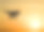 四旋翼飞行器在夕阳的背景下形成剪影素材图片