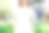 亚洲嬉皮女孩棕色长发在白色空白t恤站在街道中央。一位身着街头服饰的女性站在绿色的城市背景上。为文本或设计留出模拟空间。素材图片