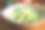 白碗里的生黄瓜绿意面和木桌上的蔬菜素材图片