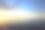 日落在一个多云的天空在开放的波罗的海与真正遥远的船剪影。素材图片