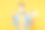 年轻男子在无菌口罩摆孤立的黄色背景工作室肖像。疫情大流行冠状病毒2019-ncov sars covid-19流感病毒概念拿礼券做赢家手势素材图片